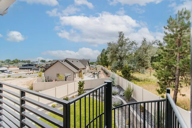 a front view of a house with swimming pool having outdoor seating