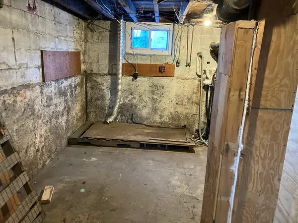 a bathroom with a granite countertop shower and a sink