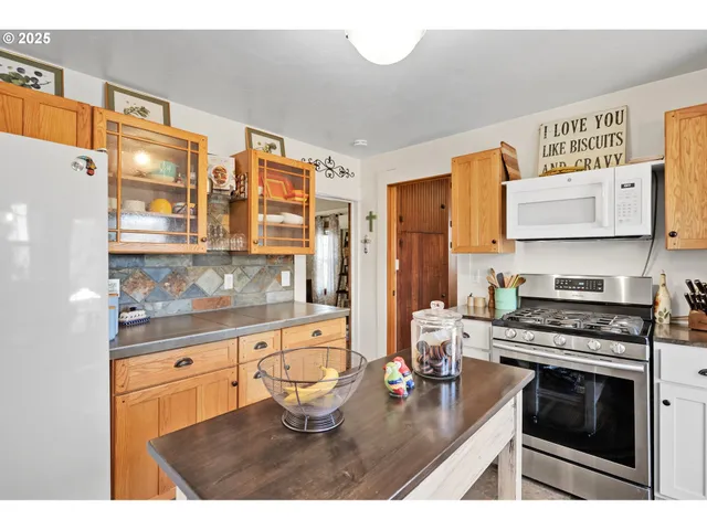 a kitchen with a stove a refrigerator and a stove