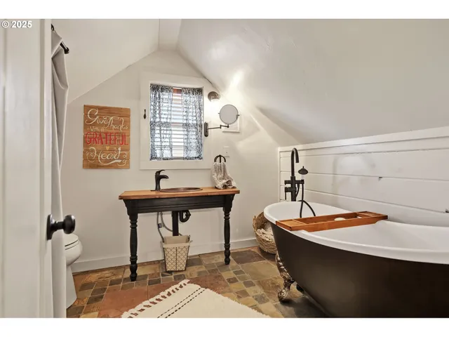 a living room with a table and a window