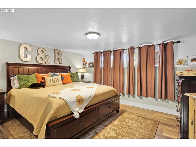 a bedroom with a bed and a book shelf