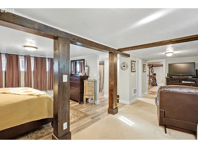 a bedroom with a bed and a television in it