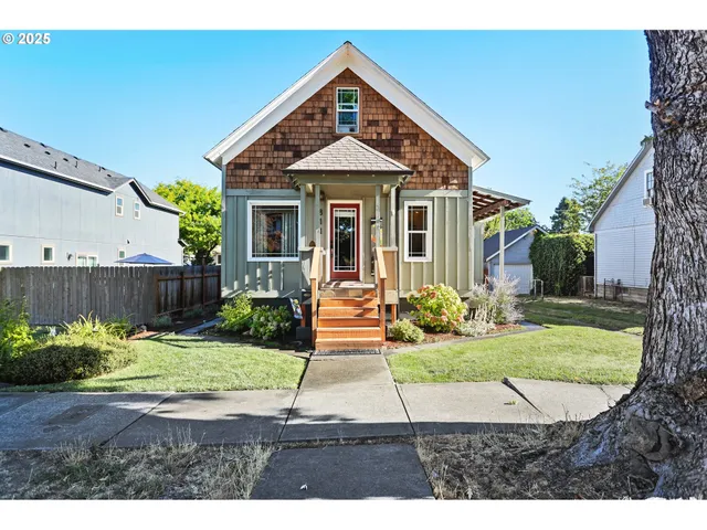 a front view of a house with garden