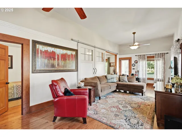 a living room with furniture or couch and a view of kitchen