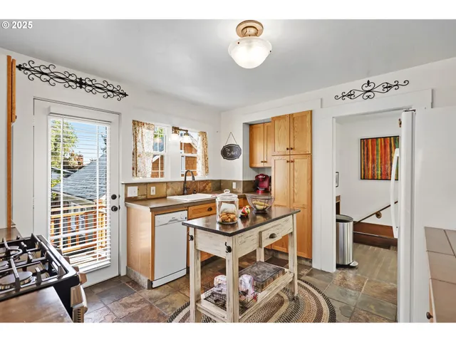 a living room with furniture a dining table and a stove
