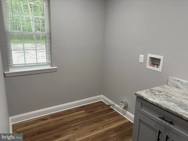 a room with a bed and a window