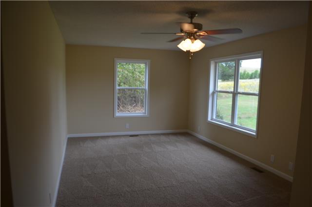 110 Shorter Road Lebanon, TN 37090 - Photo 6 of 16 Great room includes new carpet and ceiling fan and overlooks front yard.