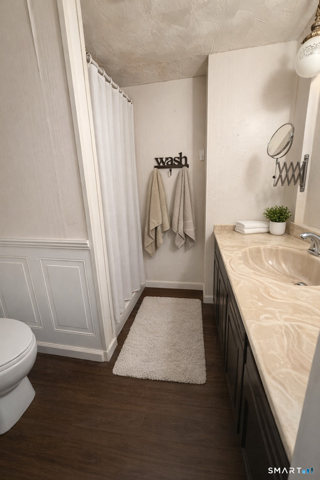 3 7th Street Newington, CT 06111 - Photo 11 of 13 a bathroom with a granite countertop sink toilet and shower