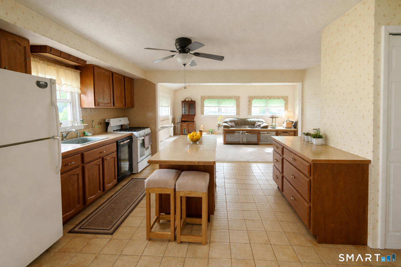 3 7th Street Newington, CT 06111 - Photo 5 of 13 a kitchen with stainless steel appliances granite countertop a sink counter space cabinets and a large window
