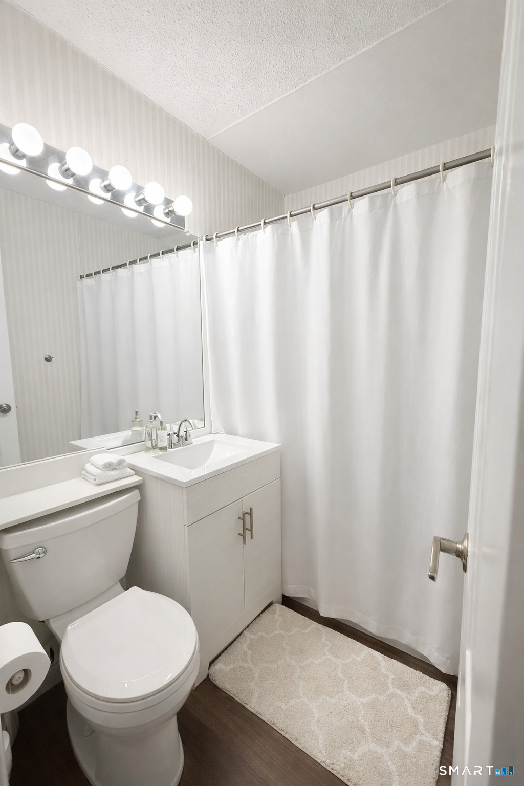 3 7th Street Newington, CT 06111 - Photo 8 of 13 a bathroom with a toilet a sink and a shower