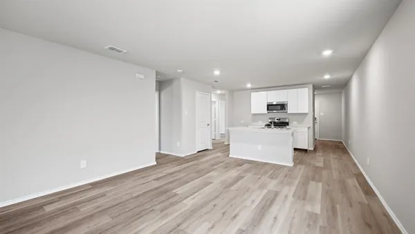a kitchen with a sink and a refrigerator