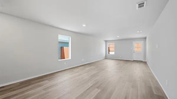 a view of a kitchen with microwave and cabinets