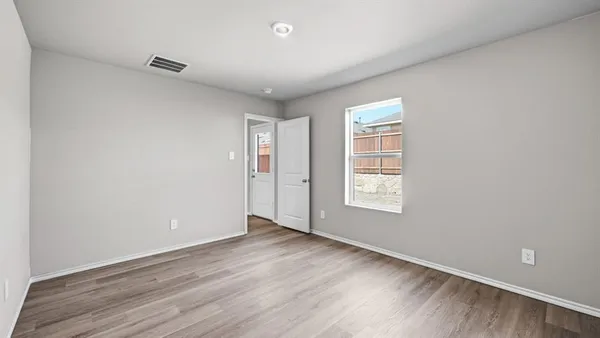 a view of a kitchen with a sink and a large window