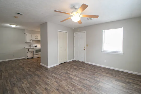 a view of an empty room with a window