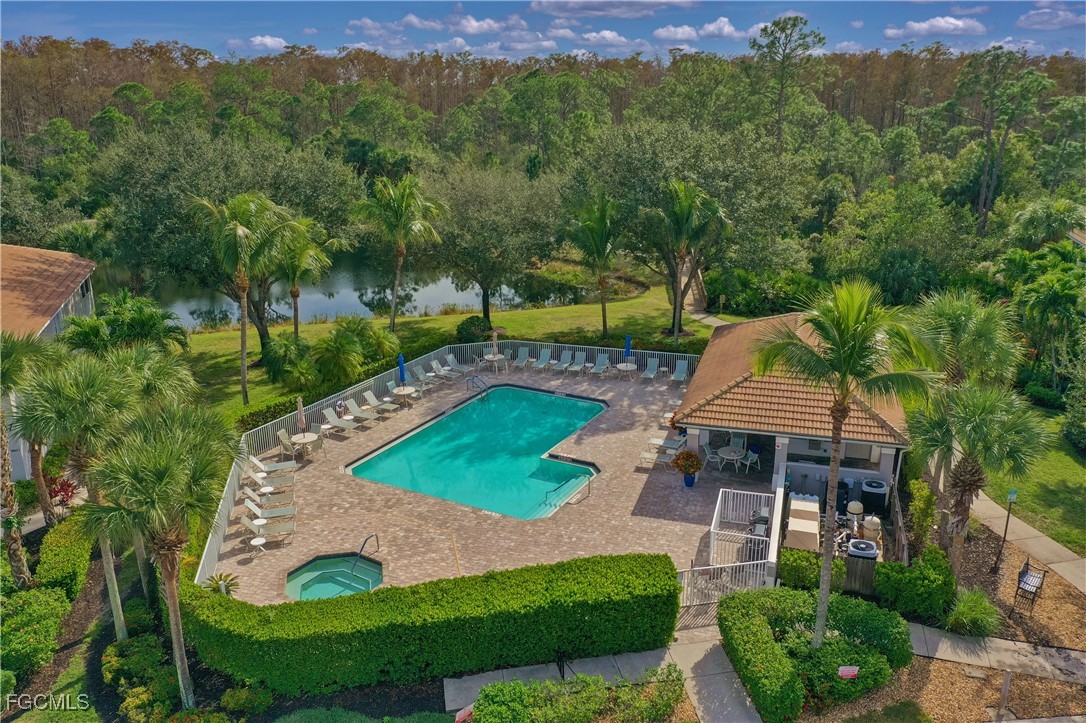 9631 Hemingway Lane, Unit 3610 Fort Myers, FL 33913 - Photo 14 of 21 an aerial view of a house with garden space seating area and trees around