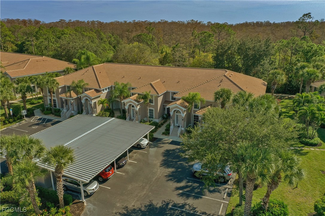 9631 Hemingway Lane, Unit 3610 Fort Myers, FL 33913 - Photo 2 of 21 an aerial view of a house with a yard