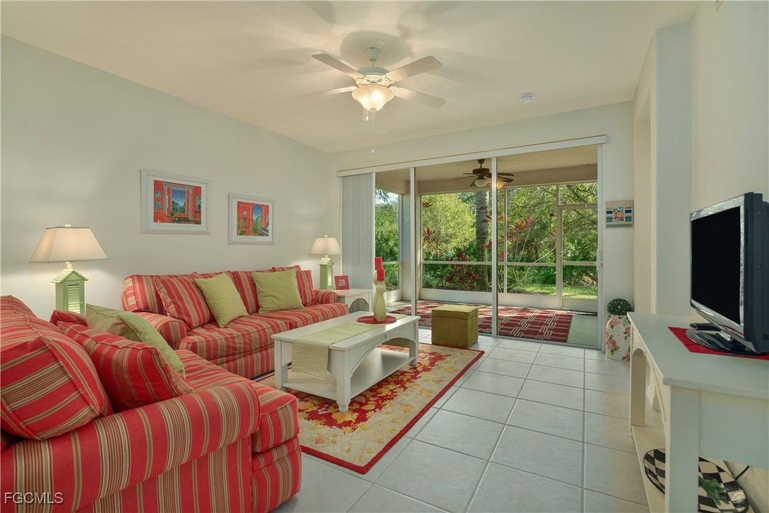 9631 Hemingway Lane, Unit 3610 Fort Myers, FL 33913 - Photo 4 of 21 a living room with furniture and a flat screen tv
