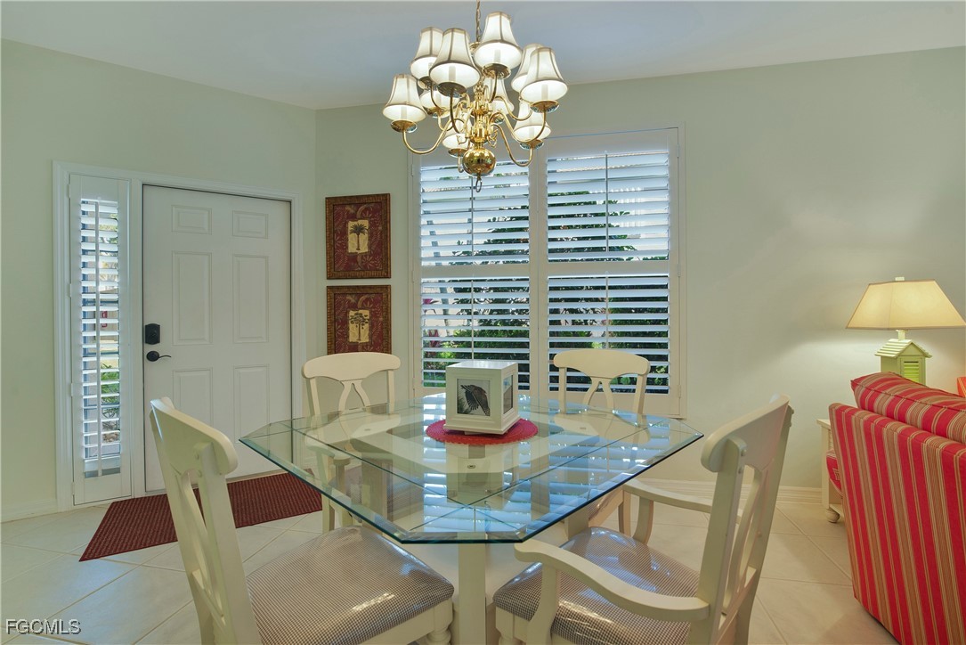 9631 Hemingway Lane, Unit 3610 Fort Myers, FL 33913 - Photo 6 of 21 a dining room with furniture and window