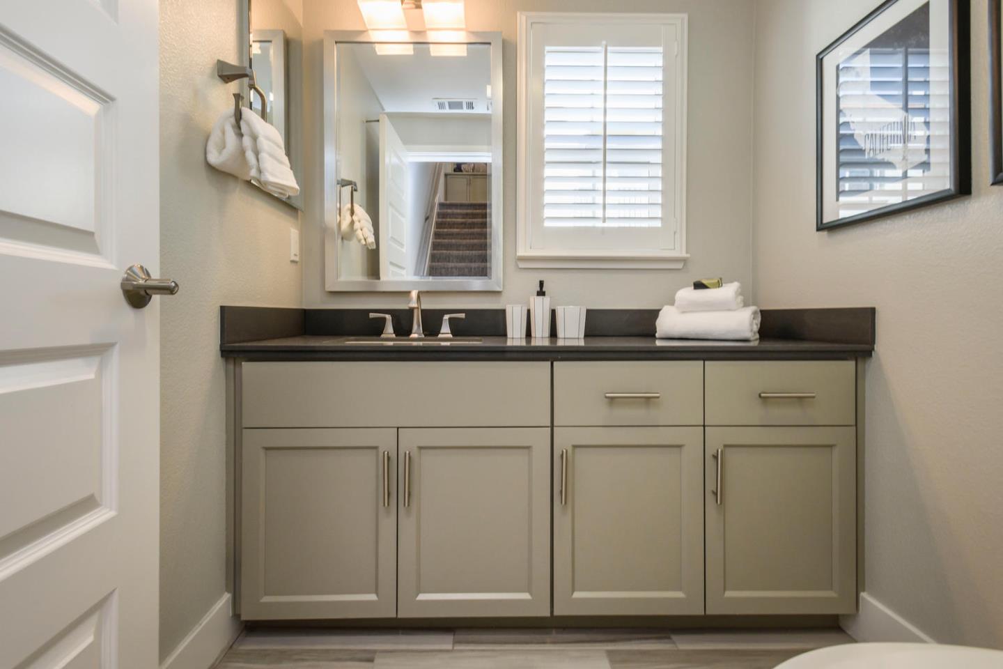 2864 Baze Road San Mateo, CA 94403 - Photo 12 of 20 a bathroom with a sink and a mirror