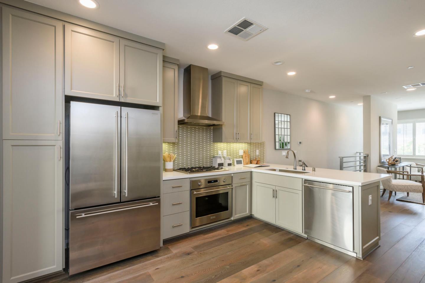 2864 Baze Road San Mateo, CA 94403 - Photo 8 of 20 a kitchen with a sink stainless steel appliances and cabinets