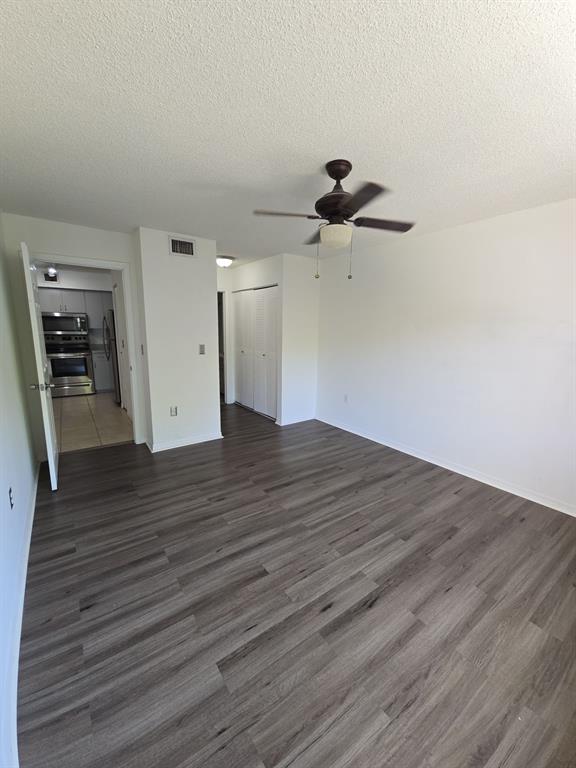 12172 St Andrews Place, Unit 305 Miramar, FL 33025 - Photo 17 of 35 a view of empty room with wooden floor