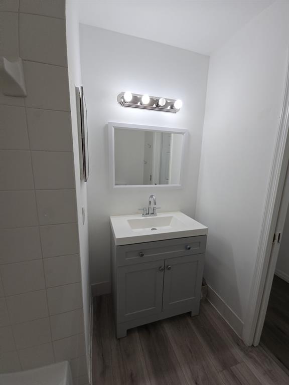 12172 St Andrews Place, Unit 305 Miramar, FL 33025 - Photo 25 of 35 a bathroom with a sink and a mirror