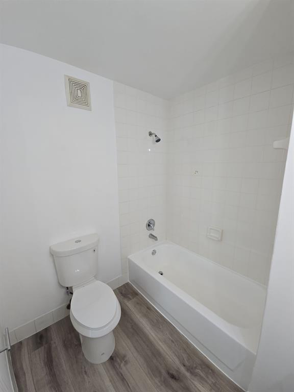 12172 St Andrews Place, Unit 305 Miramar, FL 33025 - Photo 26 of 35 a bathroom with a bathtub and toilet