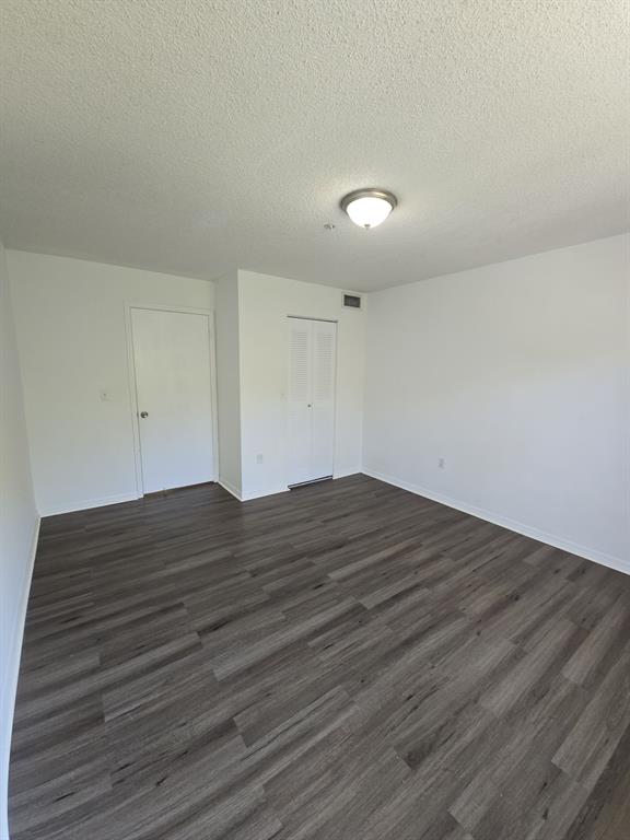 12172 St Andrews Place, Unit 305 Miramar, FL 33025 - Photo 30 of 35 a view of empty room with wooden floor