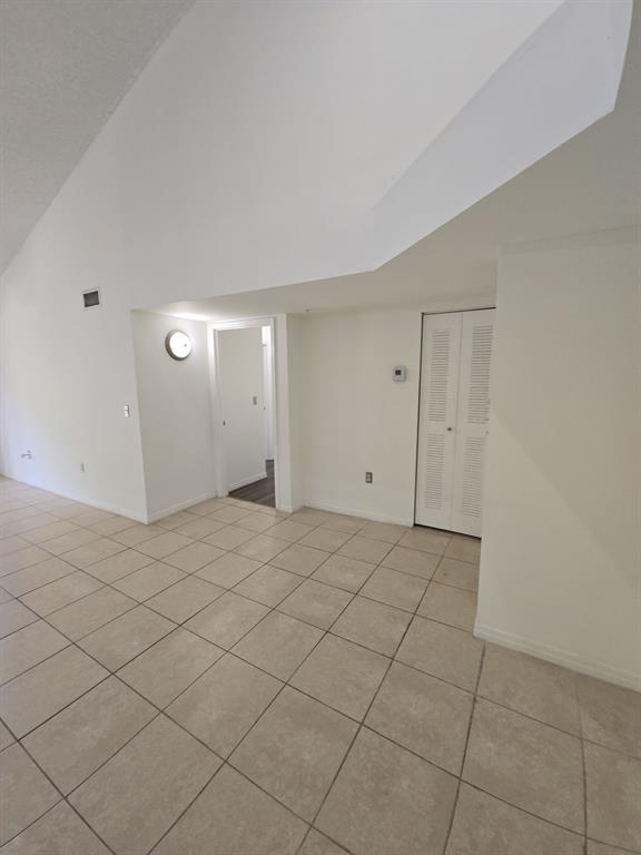 12172 St Andrews Place, Unit 305 Miramar, FL 33025 - Photo 3 of 35 a view of an empty room and wooden floor