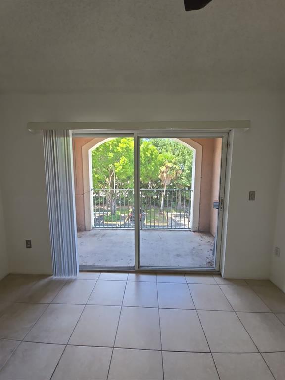 12172 St Andrews Place, Unit 305 Miramar, FL 33025 - Photo 7 of 35 a view of empty room with floor to ceiling window