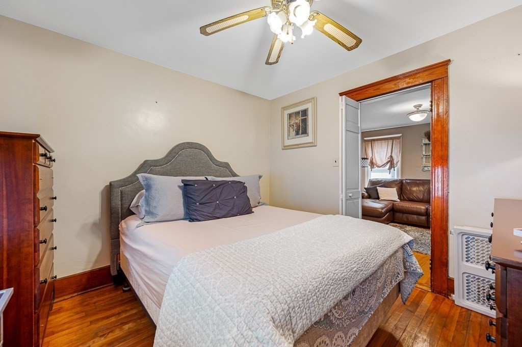 18 Prentice Street Worcester, MA 01604 - Photo 11 of 42 a bedroom with a bed and wooden floor