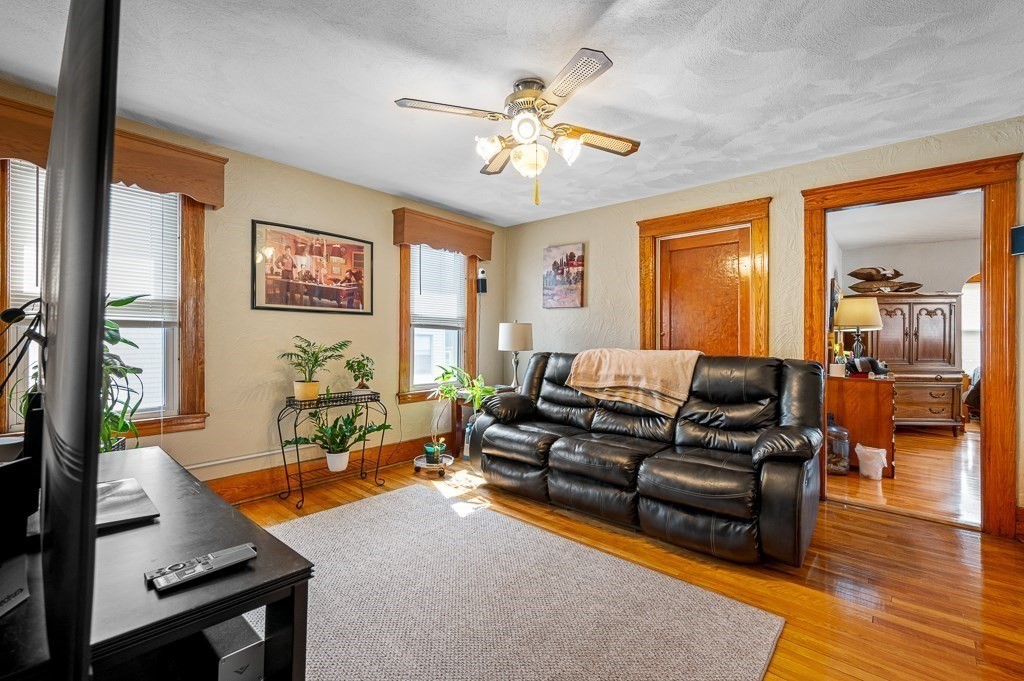 18 Prentice Street Worcester, MA 01604 - Photo 15 of 42 a living room with furniture and a large window
