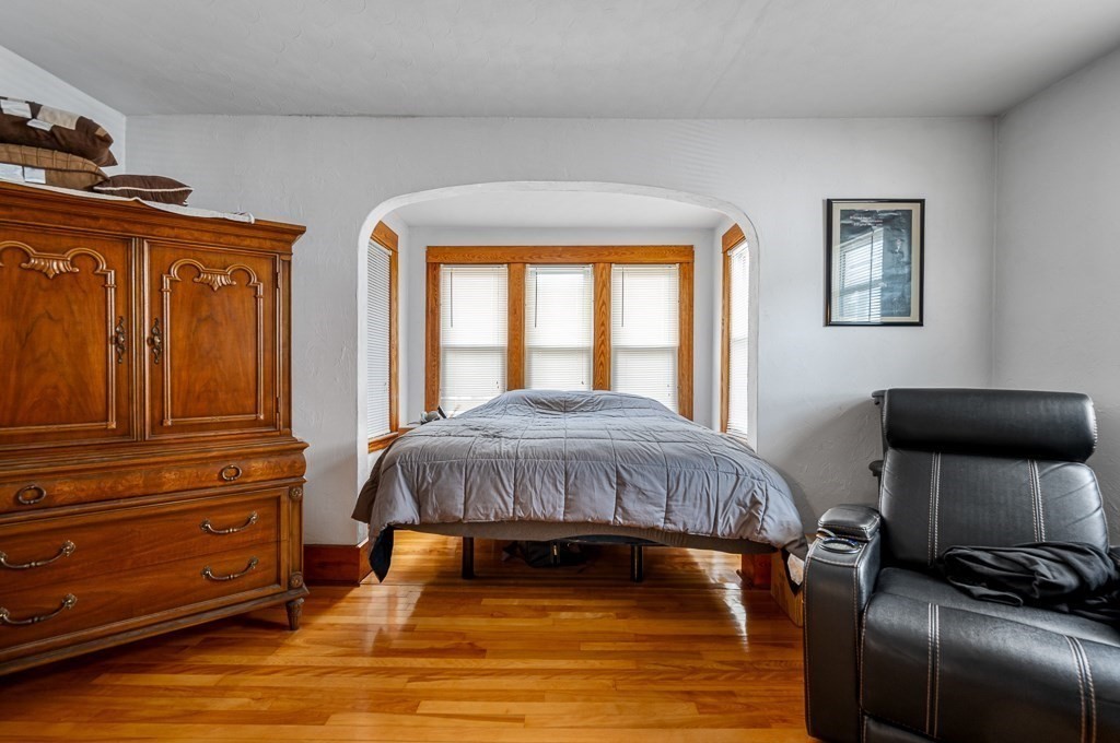 18 Prentice Street Worcester, MA 01604 - Photo 20 of 42 a bedroom with a bed and a dresser