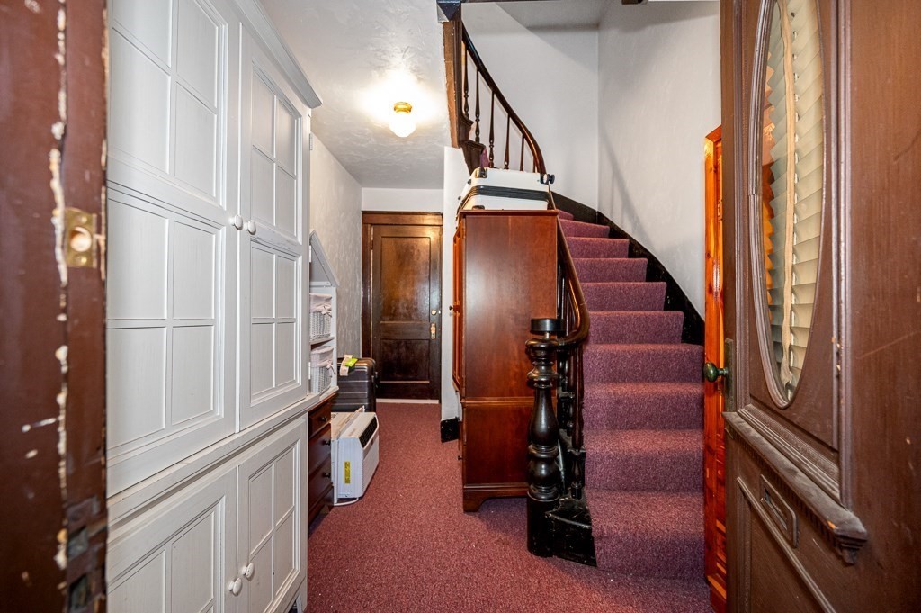 18 Prentice Street Worcester, MA 01604 - Photo 2 of 42 a view of an entryway with staircase