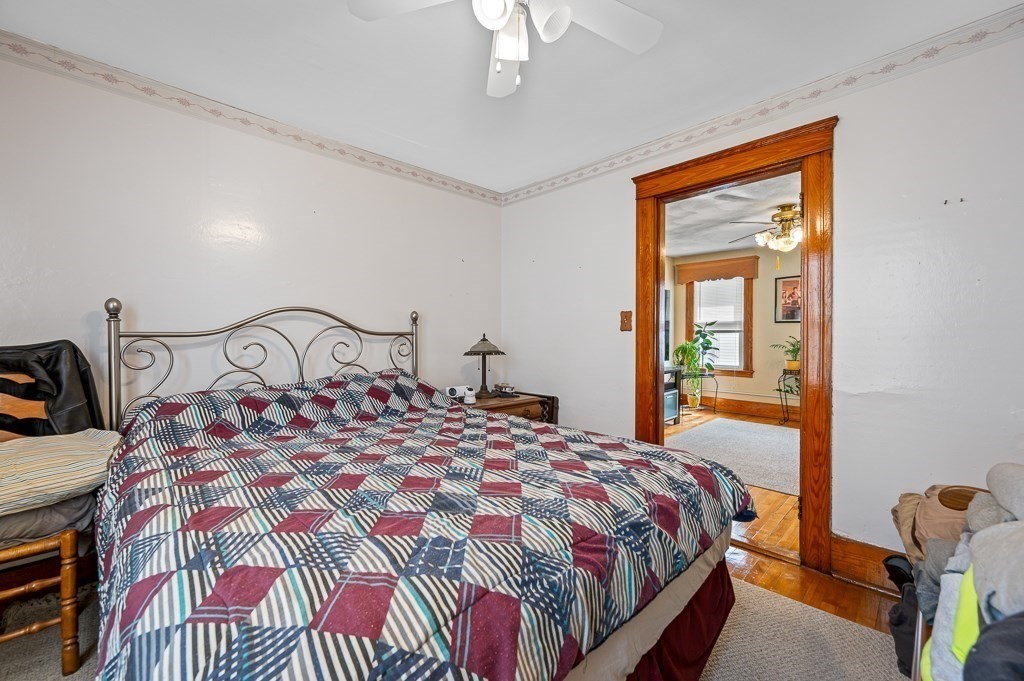 18 Prentice Street Worcester, MA 01604 - Photo 23 of 42 a bedroom with a bed next to a window