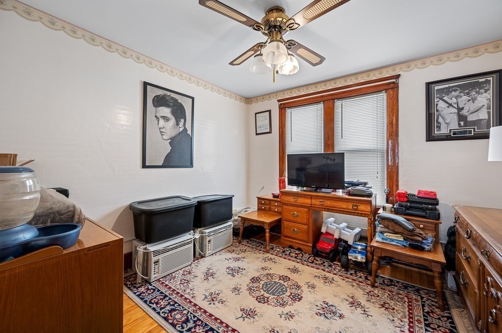 18 Prentice Street Worcester, MA 01604 - Photo 26 of 42 a living room with furniture and a flat screen tv