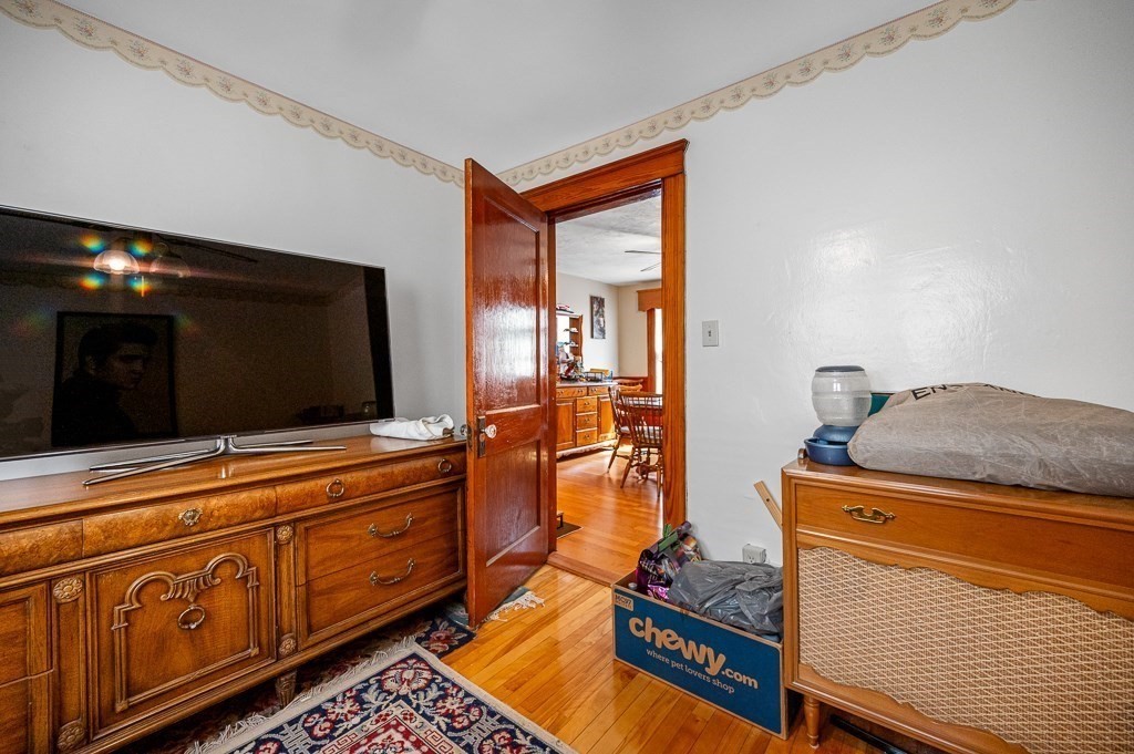 18 Prentice Street Worcester, MA 01604 - Photo 27 of 42 a living room with furniture and flat screen tv