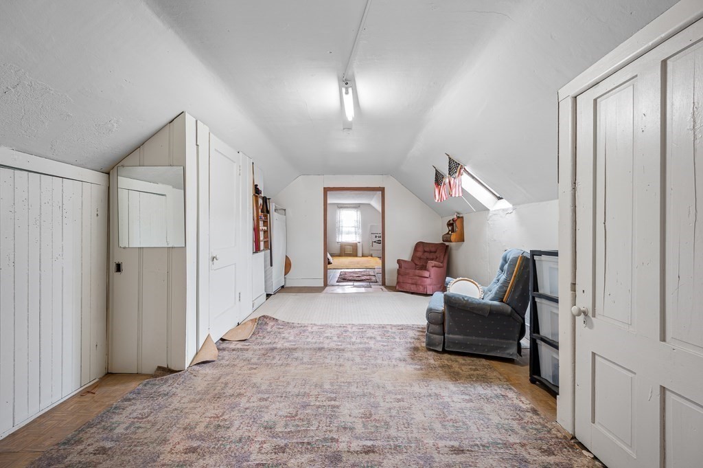 18 Prentice Street Worcester, MA 01604 - Photo 29 of 42 a living room with furniture and a chandelier