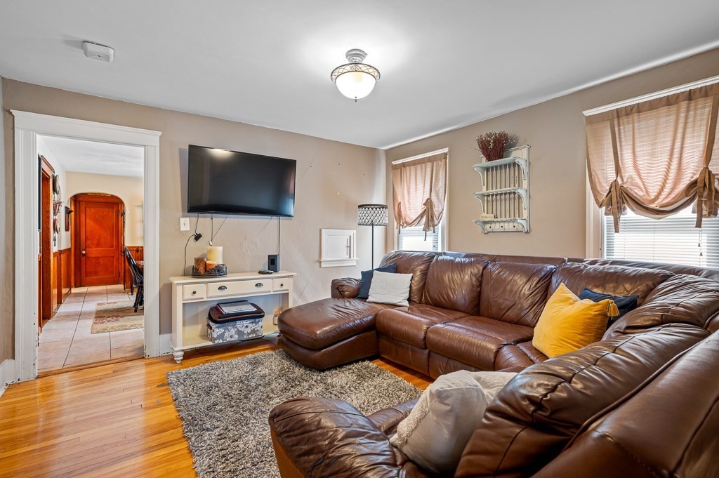 18 Prentice Street Worcester, MA 01604 - Photo 3 of 42 a living room with furniture and a flat screen tv