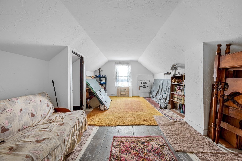 18 Prentice Street Worcester, MA 01604 - Photo 31 of 42 a bed room with a bed and a book shelf