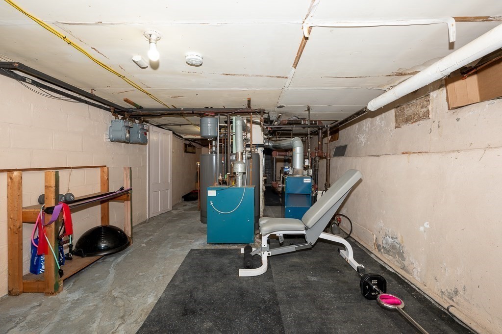 18 Prentice Street Worcester, MA 01604 - Photo 35 of 42 a view of storage and utility room with stairs