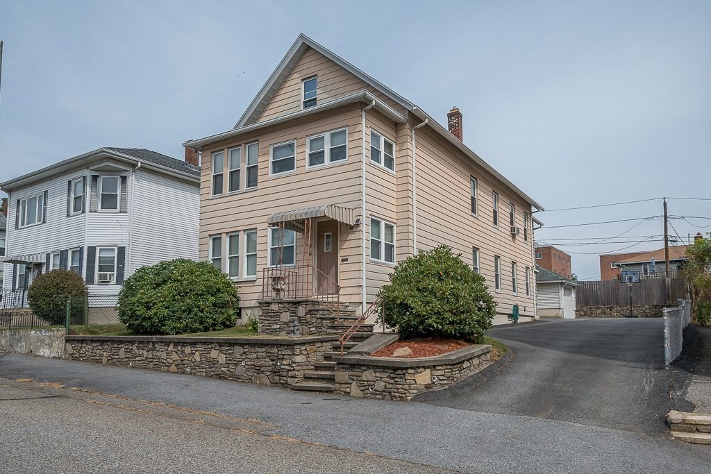 18 Prentice Street Worcester, MA 01604 - Photo 37 of 42 a front view of a house with a yard