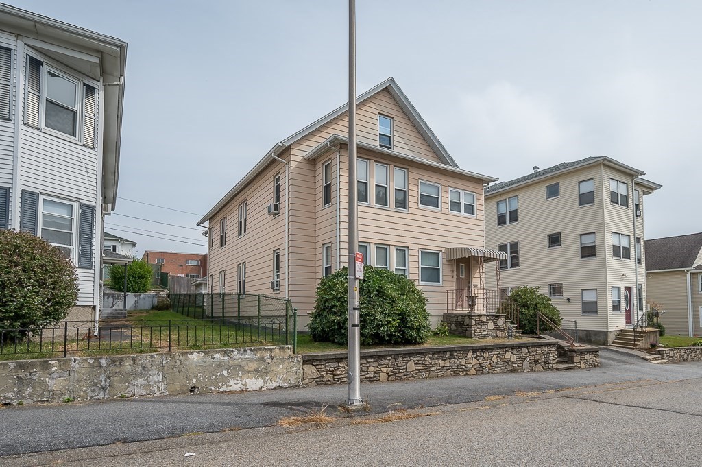 18 Prentice Street Worcester, MA 01604 - Photo 38 of 42 a view of a house next to a yard
