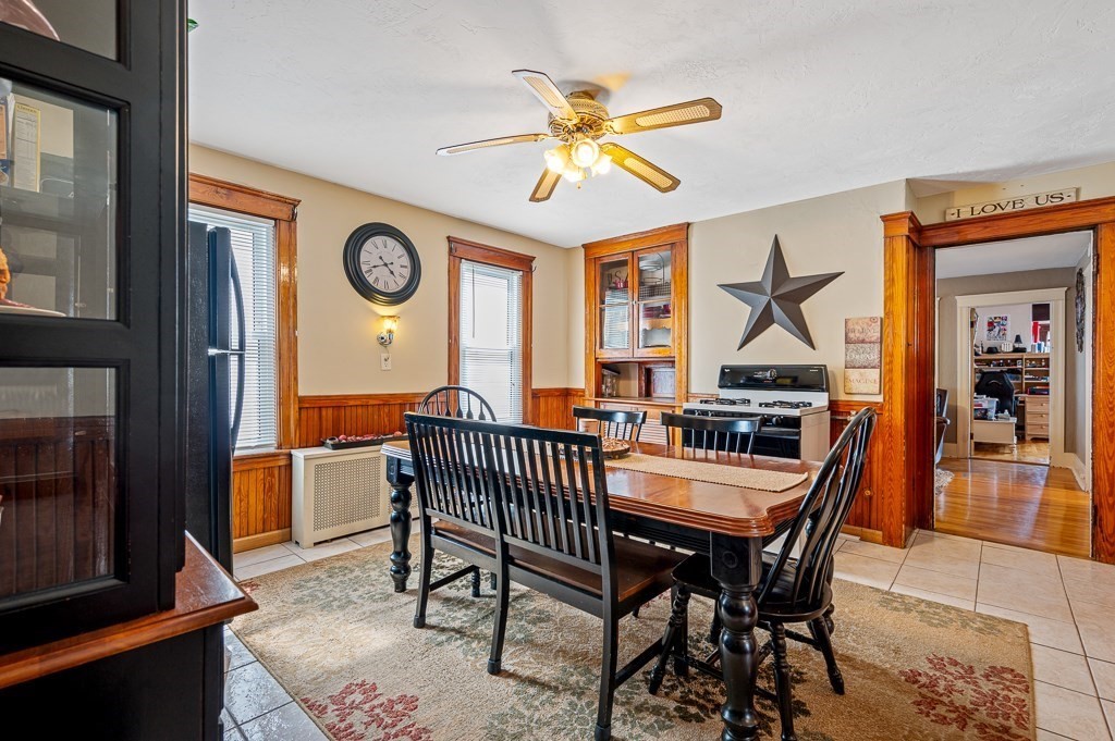 18 Prentice Street Worcester, MA 01604 - Photo 6 of 42 a dining room with furniture a rug and a window