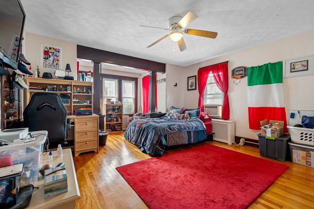 18 Prentice Street Worcester, MA 01604 - Photo 8 of 42 a bed room with a bed and a chandelier