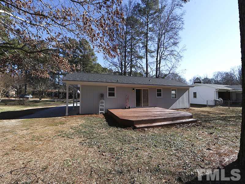 5912 Meadowbrook Road Raleigh, NC 27603 - Photo 12 of 12 a front view of house with yard and seating space
