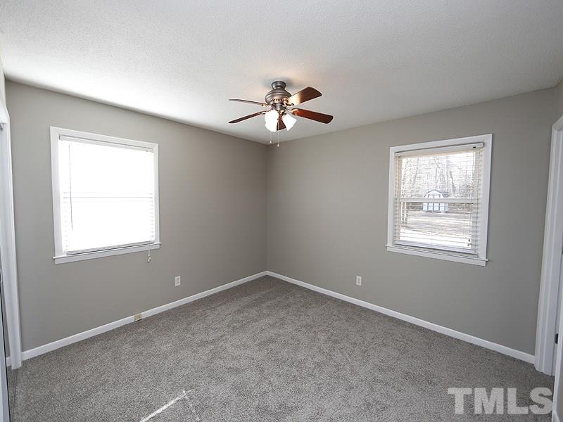 5912 Meadowbrook Road Raleigh, NC 27603 - Photo 6 of 12 a view of a room with a ceiling fan and window