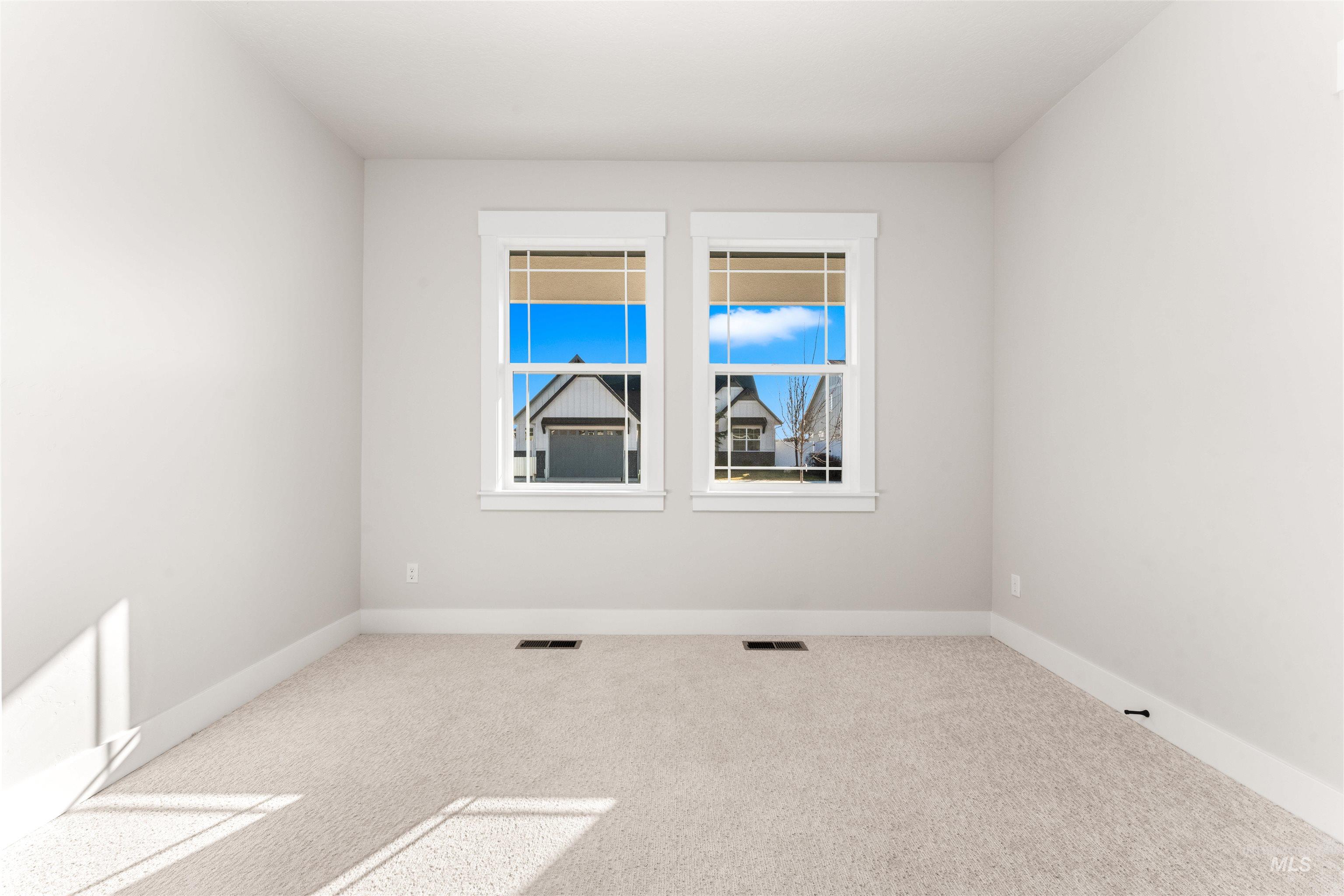 8084 Tandy Cv Street Middleton, ID 83644 - Photo 25 of 46 Carpeted empty room featuring baseboards