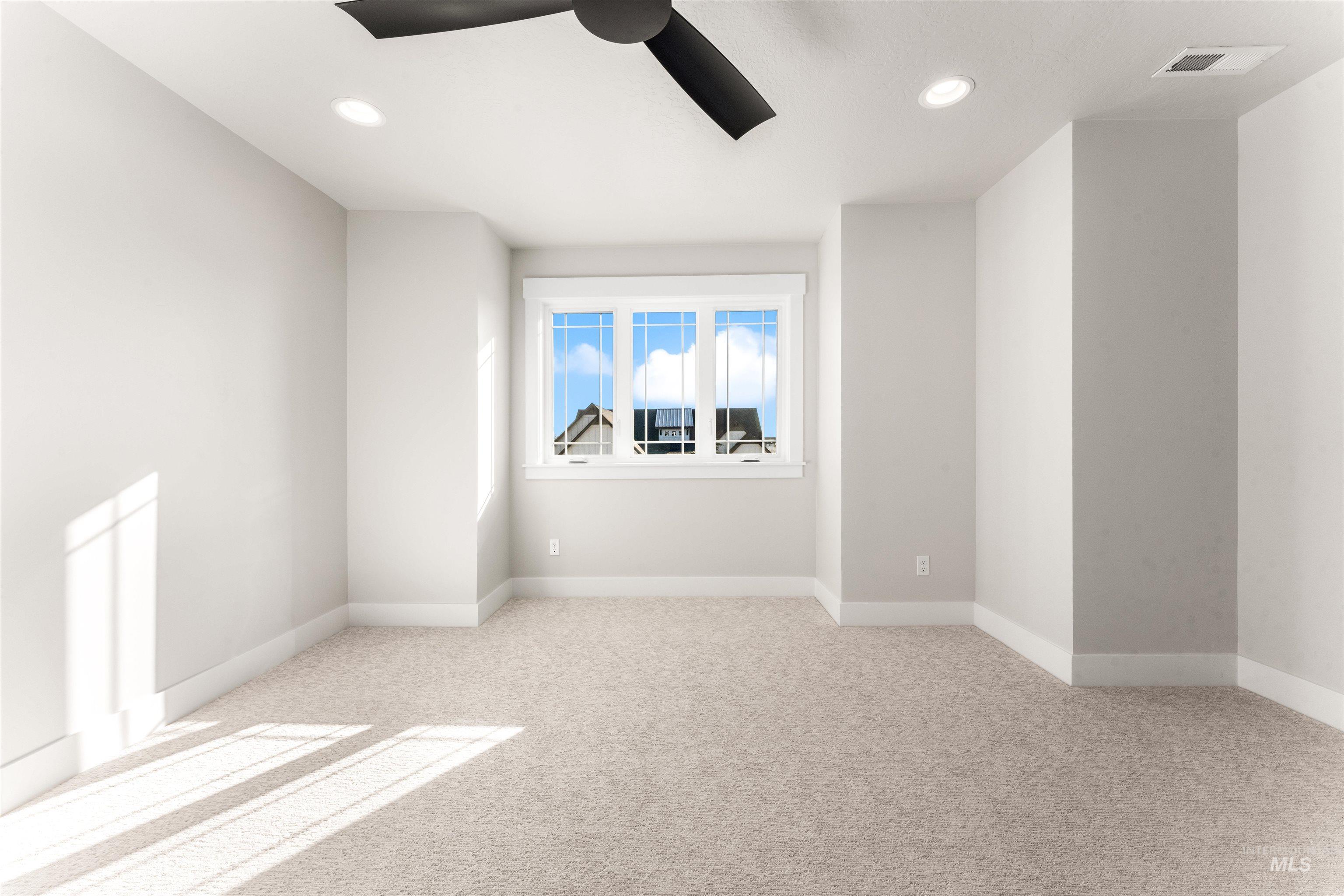 8084 Tandy Cv Street Middleton, ID 83644 - Photo 29 of 46 Spare room featuring a ceiling fan, light colored carpet, and recessed lighting