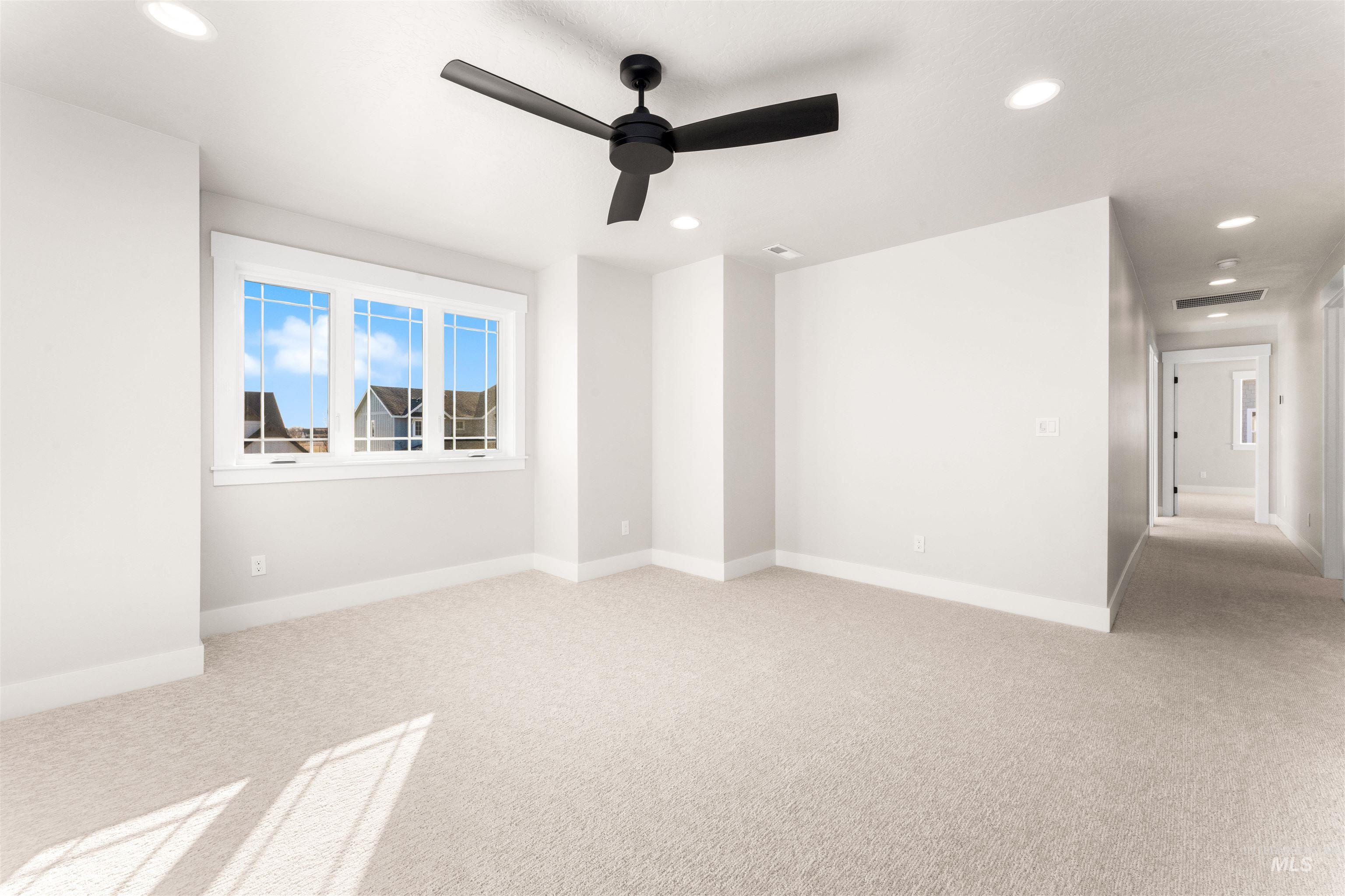 8084 Tandy Cv Street Middleton, ID 83644 - Photo 30 of 46 Unfurnished room featuring light colored carpet, a ceiling fan, and recessed lighting